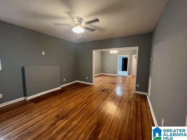 2732 29th St, Birmingham, AL 35208 - empty room with ceiling fan and wood finished floors