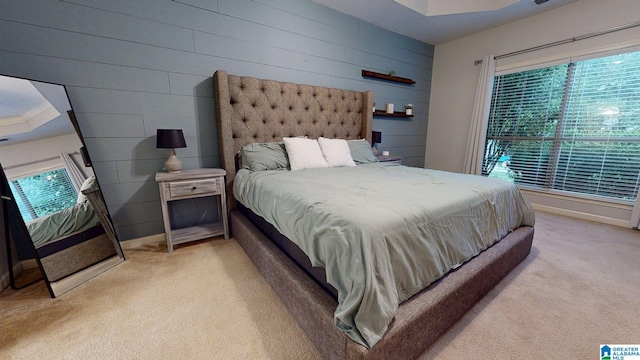 2049 Forest Lakes Ln, Sterrett, AL 35147 - bedroom with light colored carpet, multiple windows, and wooden walls
