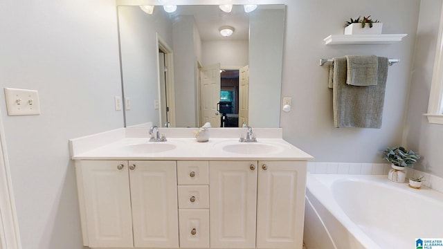 2049 Forest Lakes Ln, Sterrett, AL 35147 - bathroom featuring double vanity and a garden tub