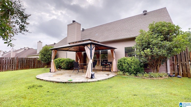 2049 Forest Lakes Ln, Sterrett, AL 35147 - fenced backyard featuring a gazebo and a patio