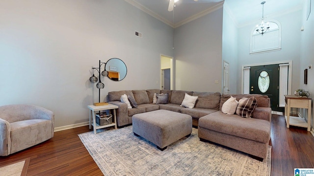 2049 Forest Lakes Ln, Sterrett, AL 35147 - living area with a high ceiling, wood finished floors, a chandelier, ornamental molding, and a ceiling fan