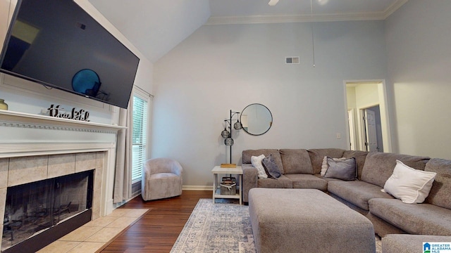 2049 Forest Lakes Ln, Sterrett, AL 35147 - living area featuring high vaulted ceiling, wood finished floors, ornamental molding, a fireplace, and a ceiling fan