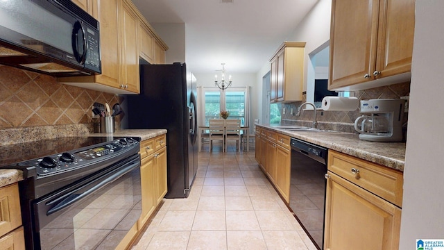 2049 Forest Lakes Ln, Sterrett, AL 35147 - kitchen with black appliances, a chandelier, decorative backsplash, and light tile patterned floors