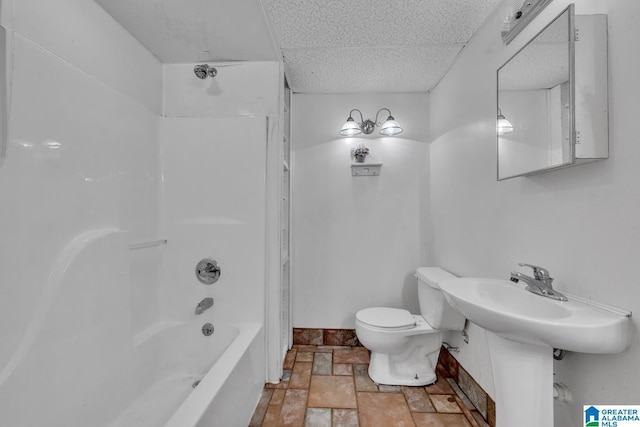 7741 John Pelham Trl, Mccalla, AL 35111 - full bathroom with stone tile floors, a drop ceiling, and shower / tub combination