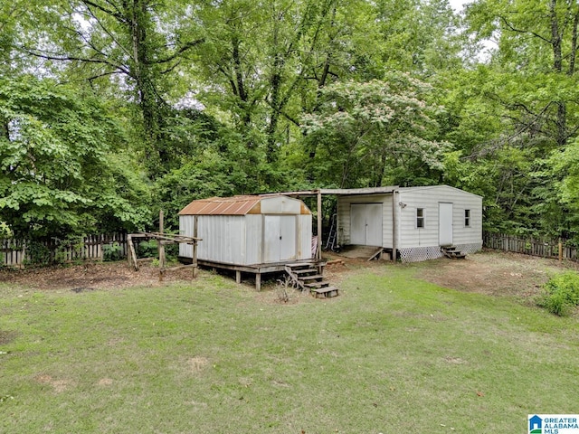 7741 John Pelham Trl, Mccalla, AL 35111 - view of yard featuring a shed, entry steps, and a wooded view