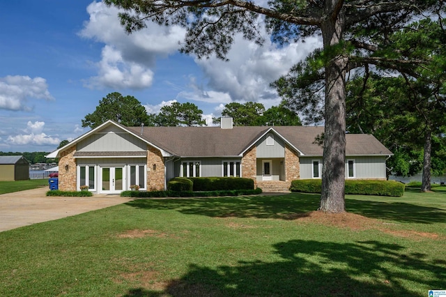 212 Bellbrook Dr, Cropwell, AL 35054 - ranch-style house featuring french doors, a front yard, a chimney, and concrete driveway