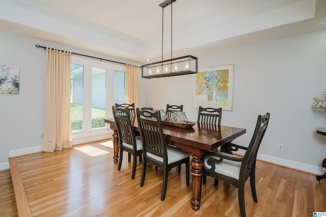 212 Bellbrook Dr, Cropwell, AL 35054 - dining area featuring a tray ceiling, light wood-style floors, and crown molding