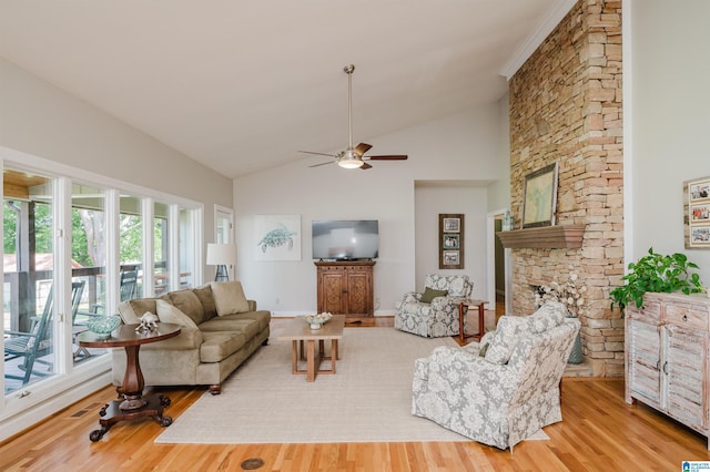 212 Bellbrook Dr, Cropwell, AL 35054 - living area featuring wood finished floors, ceiling fan, lofted ceiling, and a stone fireplace