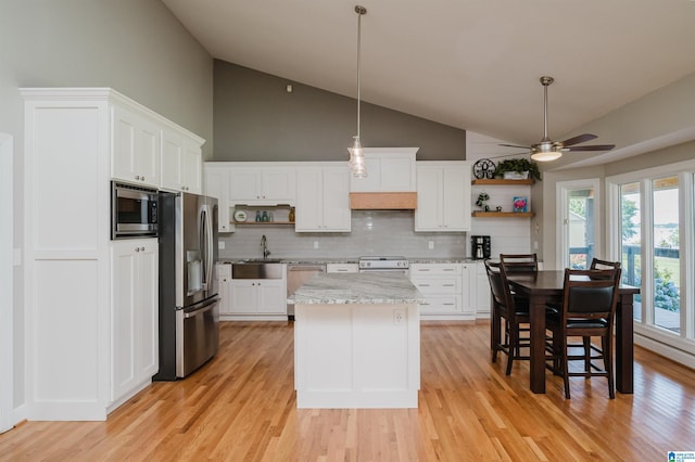 212 Bellbrook Dr, Cropwell, AL 35054 - kitchen featuring appliances with stainless steel finishes, open shelves, backsplash, a ceiling fan, and light wood-type flooring