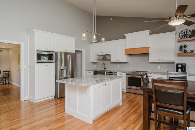 212 Bellbrook Dr, Cropwell, AL 35054 - kitchen with stainless steel appliances, open shelves, high vaulted ceiling, a ceiling fan, and decorative backsplash