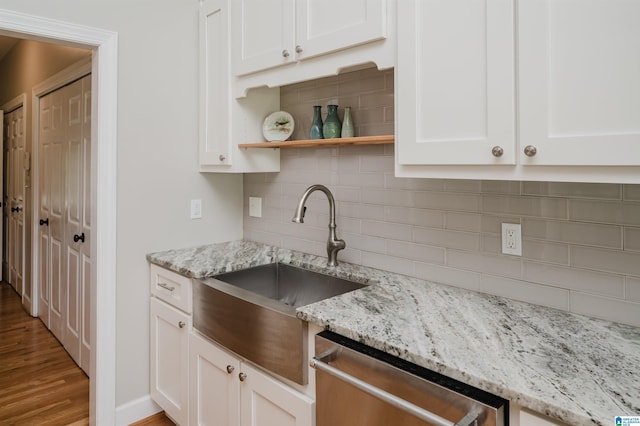 212 Bellbrook Dr, Cropwell, AL 35054 - kitchen featuring stainless steel dishwasher, white cabinetry, backsplash, wood finished floors, and light stone counters