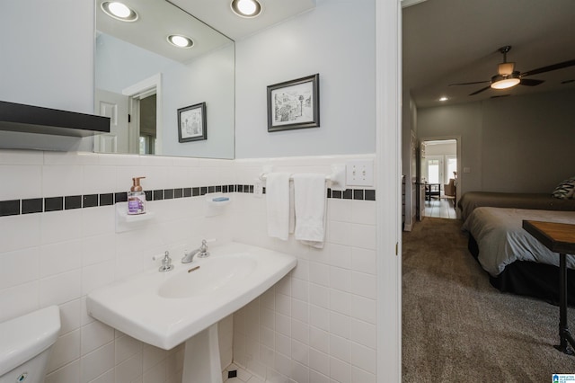 212 Bellbrook Dr, Cropwell, AL 35054 - half bath with ensuite bathroom, tile walls, a ceiling fan, a wainscoted wall, and recessed lighting