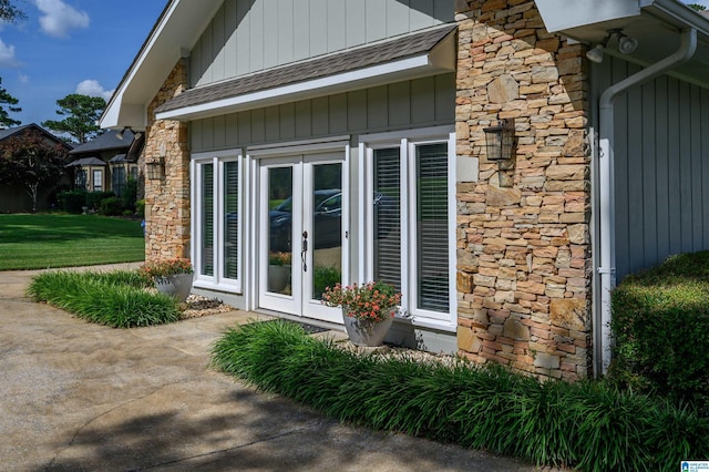 212 Bellbrook Dr, Cropwell, AL 35054 - view of exterior entry with stone siding, french doors, and a lawn