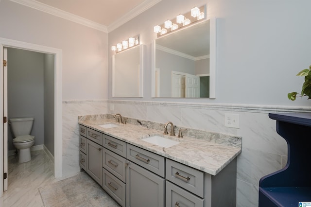 212 Bellbrook Dr, Cropwell, AL 35054 - bathroom featuring double vanity, crown molding, tile walls, wainscoting, and marble finish floors