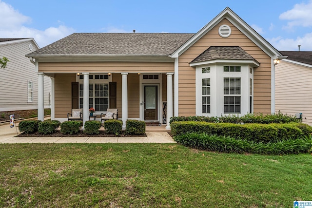 5433 Wisteria Trce, Trussville, AL 35173 - view of front of house with a porch, a front lawn, and roof with shingles
