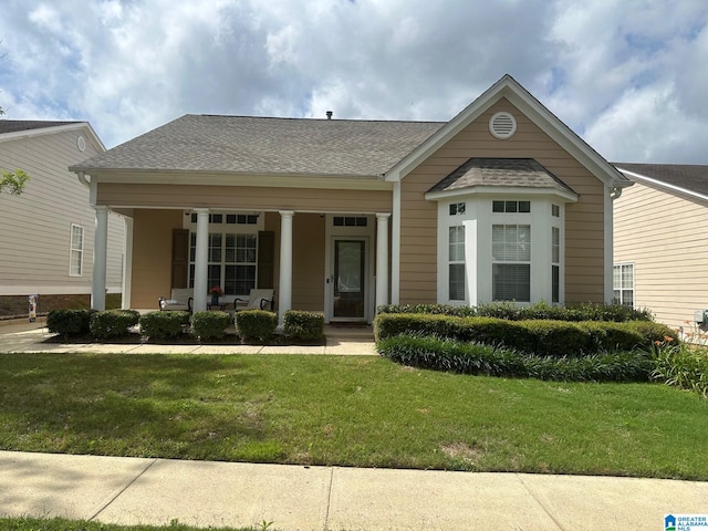 5433 Wisteria Trce, Trussville, AL 35173 - view of front of home featuring covered porch, a front lawn, and a shingled roof
