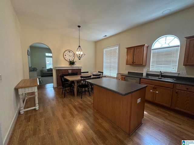 5433 Wisteria Trce, Trussville, AL 35173 - kitchen featuring dark countertops, a center island, dark wood finished floors, and plenty of natural light