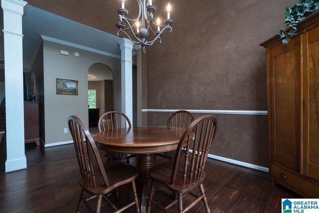 214 Quail Ridge Rd, Helena, AL 35080 - dining space with dark wood-style floors, arched walkways, ornamental molding, and a chandelier