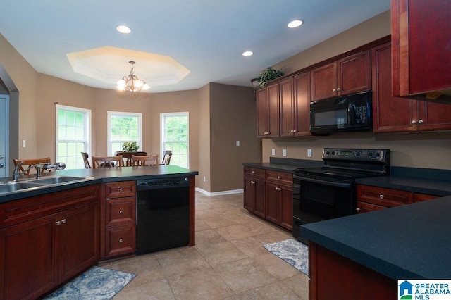 214 Quail Ridge Rd, Helena, AL 35080 - kitchen with black appliances, dark countertops, a tray ceiling, a chandelier, and recessed lighting