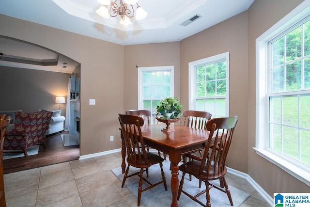 214 Quail Ridge Rd, Helena, AL 35080 - dining room featuring a raised ceiling, ornamental molding, a chandelier, and arched walkways