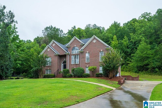 214 Quail Ridge Rd, Helena, AL 35080 - view of front of house featuring brick siding, a front yard, and concrete driveway