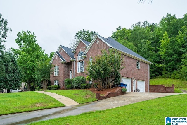 214 Quail Ridge Rd, Helena, AL 35080 - view of front of home with brick siding, an attached garage, a front yard, and concrete driveway