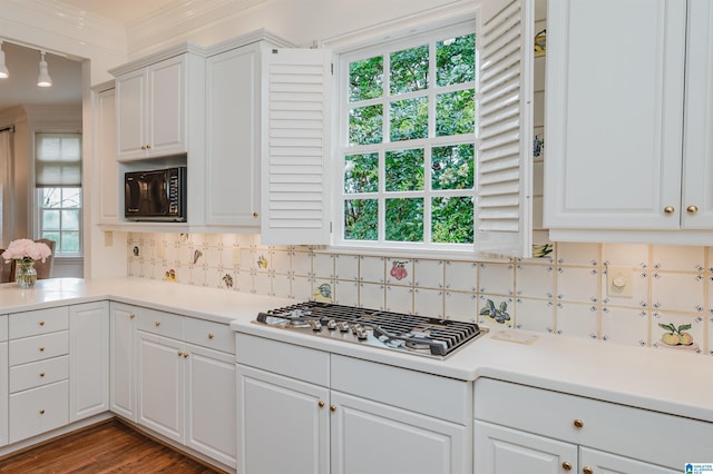 101 Mountain Ave, Mountain Brook, AL 35213 - kitchen featuring stainless steel gas stovetop, black microwave, backsplash, white cabinets, and crown molding