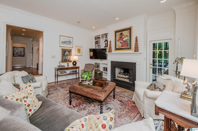 101 Mountain Ave, Mountain Brook, AL 35213 - living area with crown molding, a fireplace with flush hearth, recessed lighting, wood finished floors, and built in features