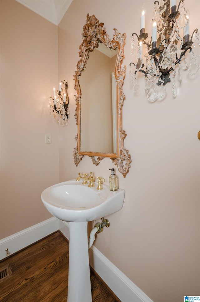 101 Mountain Ave, Mountain Brook, AL 35213 - bathroom with a chandelier and wood finished floors