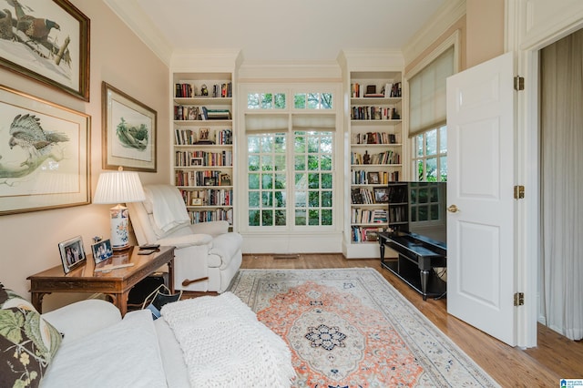101 Mountain Ave, Mountain Brook, AL 35213 - living area with plenty of natural light, wood finished floors, built in shelves, and ornamental molding