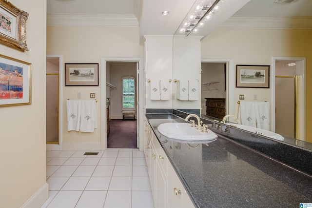 101 Mountain Ave, Mountain Brook, AL 35213 - full bathroom featuring crown molding, a stall shower, tile patterned floors, vanity, and a closet