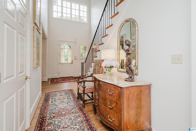 101 Mountain Ave, Mountain Brook, AL 35213 - foyer entrance with light wood-style floors, stairs, and a towering ceiling