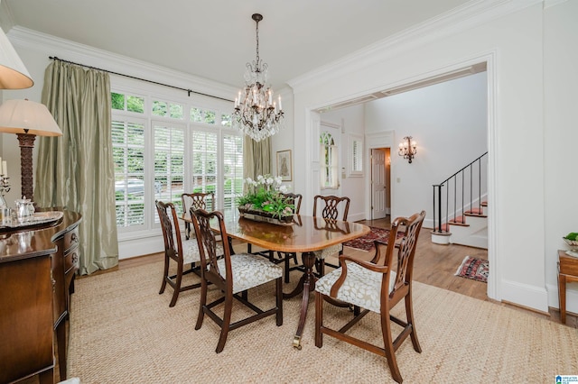 101 Mountain Ave, Mountain Brook, AL 35213 - dining room featuring light wood-style flooring, a chandelier, ornamental molding, and stairs