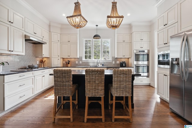 1528 Wellington Rd, Homewood, AL 35209 - kitchen featuring stainless steel appliances, a chandelier, recessed lighting, under cabinet range hood, and crown molding