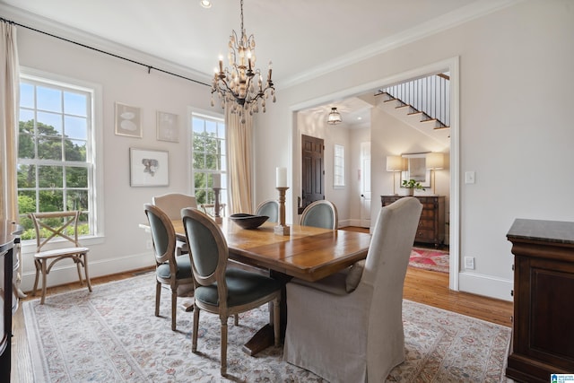 1528 Wellington Rd, Homewood, AL 35209 - dining area featuring a chandelier, light wood-style floors, and crown molding