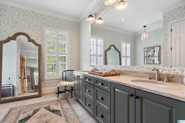1528 Wellington Rd, Homewood, AL 35209 - full bathroom featuring crown molding, wallpapered walls, double vanity, tile patterned flooring, and inlaid floor details