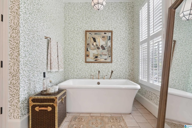 1528 Wellington Rd, Homewood, AL 35209 - bathroom featuring a freestanding bath, tile patterned flooring, and wallpapered walls