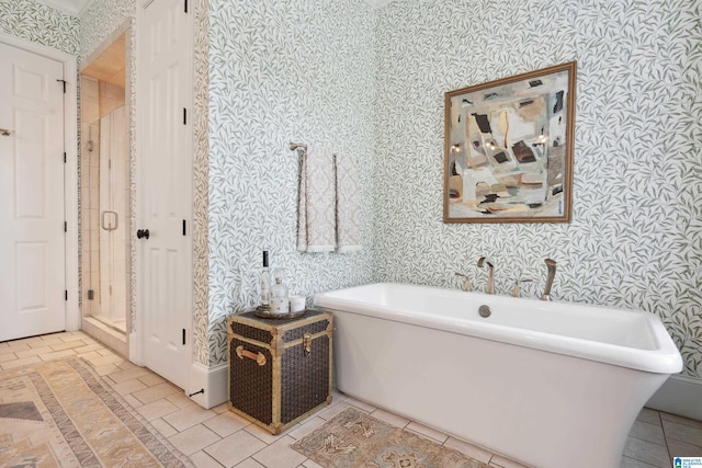 1528 Wellington Rd, Homewood, AL 35209 - full bathroom featuring wallpapered walls, a freestanding tub, and a shower stall