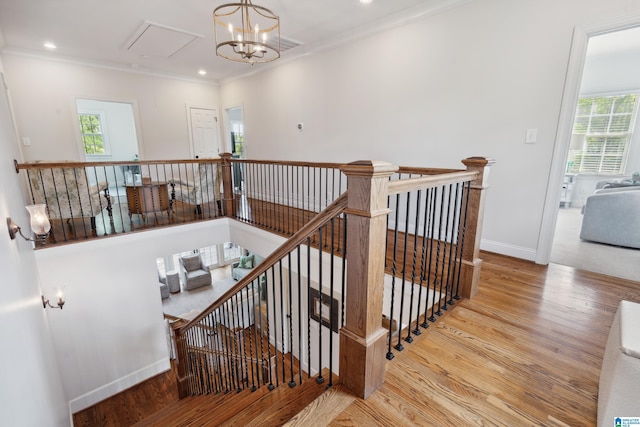 1528 Wellington Rd, Homewood, AL 35209 - staircase featuring attic access, wood finished floors, plenty of natural light, ornamental molding, and recessed lighting