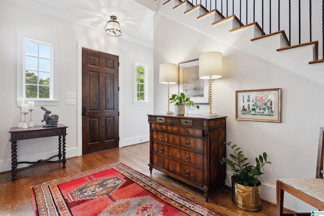 1528 Wellington Rd, Homewood, AL 35209 - foyer featuring wood finished floors and crown molding