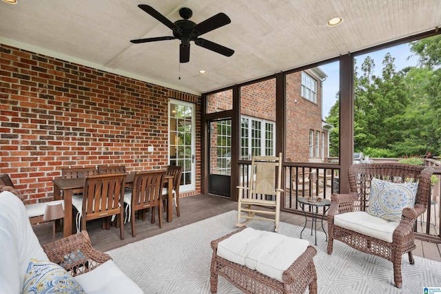 1528 Wellington Rd, Homewood, AL 35209 - sunroom / solarium featuring brick wall, healthy amount of natural light, a ceiling fan, a wall of windows, and recessed lighting