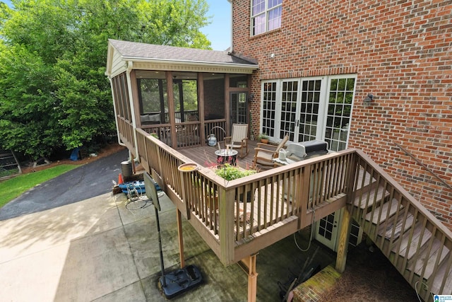 1528 Wellington Rd, Homewood, AL 35209 - wooden deck with a sunroom and a grill