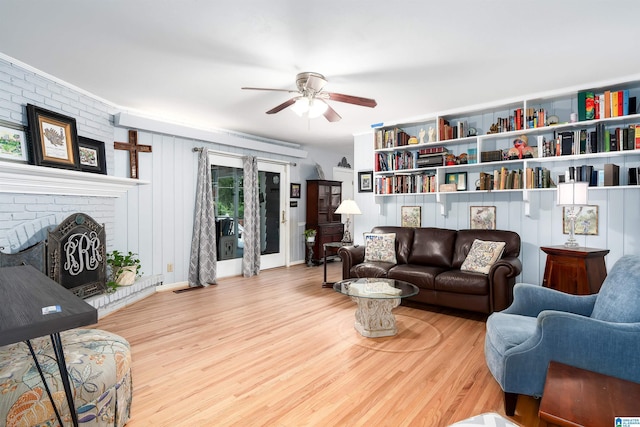 3224 Monte Doro Dr, Hoover, AL 35216 - living room featuring ceiling fan, wood finished floors, and a brick fireplace