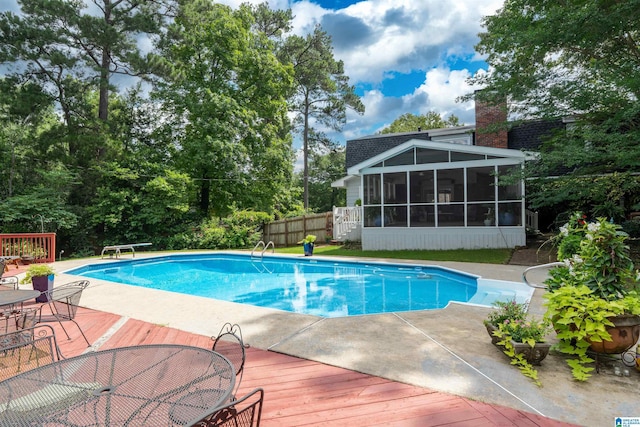 3224 Monte Doro Dr, Hoover, AL 35216 - swimming pool featuring a sunroom, a deck, and a diving board