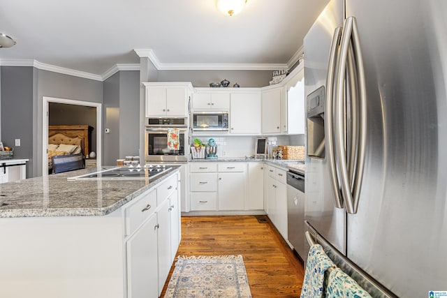 664 Jent Rd, Cordova, AL 35550 - kitchen featuring stainless steel appliances, ornamental molding, light wood-type flooring, white cabinetry, and backsplash