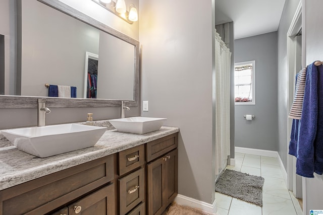 664 Jent Rd, Cordova, AL 35550 - bathroom featuring double vanity, curtained shower, and a walk in closet