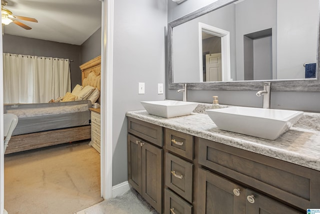 664 Jent Rd, Cordova, AL 35550 - bathroom with double vanity, ceiling fan, and connected bathroom