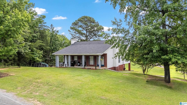 664 Jent Rd, Cordova, AL 35550 - view of front of home with a front yard, a patio, and a chimney