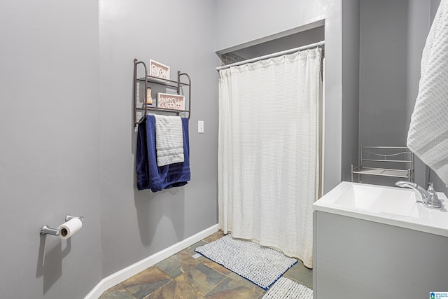 664 Jent Rd, Cordova, AL 35550 - bathroom featuring vanity, stone finish flooring, and curtained shower