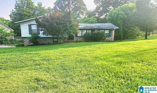 2030 Carraway St, Birmingham, AL 35235 - view of front of house with a front yard and stone siding